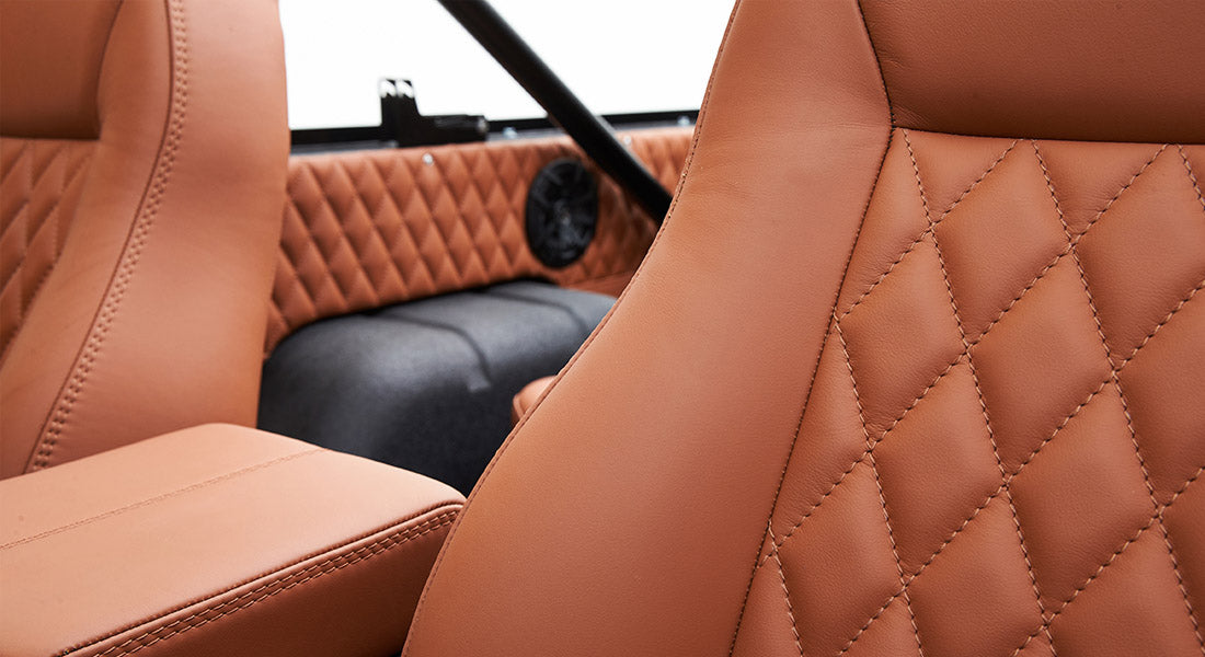 Brown leather seats with diamond stitching pattern inside Classic Ford Bronco