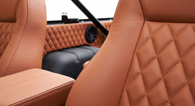 Brown leather seats with diamond stitching pattern inside Classic Ford Bronco