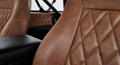 Brown leather upholstery with stitched diamond pattern on Classic Ford Bronco seat