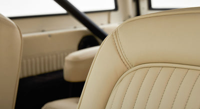 Cream leather seats with vertical stitching detail inside Classic Ford Bronco
