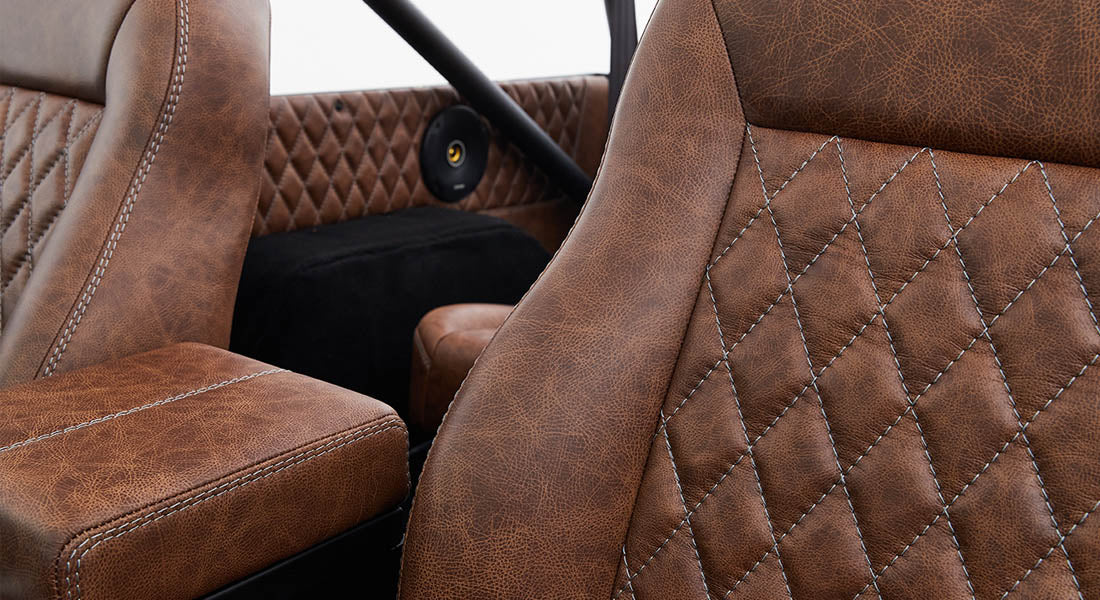 Brown leather seats with diamond stitching pattern inside Classic Ford Bronco