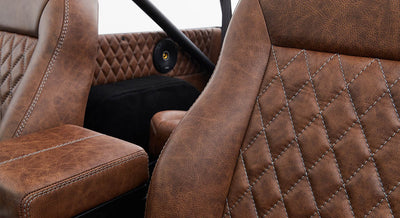 Brown leather seats with diamond stitching pattern inside Classic Ford Bronco