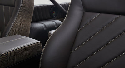 Close-up of brown leather and fabric seat upholstery inside Classic Ford Bronco