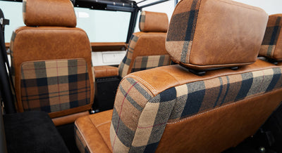 Rear view of Classic Ford Bronco seats showing brown leather and plaid upholstery