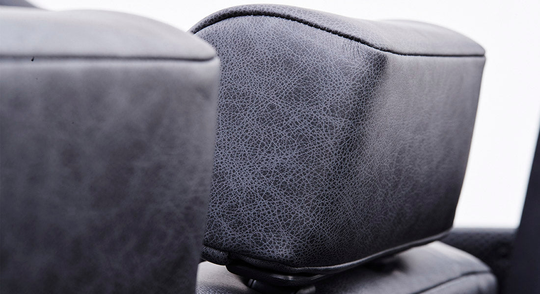 Close-up of two gray textured headrests on Classic Ford Bronco seats, showing fine details of material.