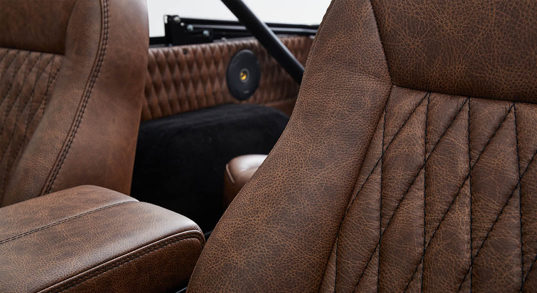 Brown leather interior upholstery with stitched pattern inside Classic Ford Bronco