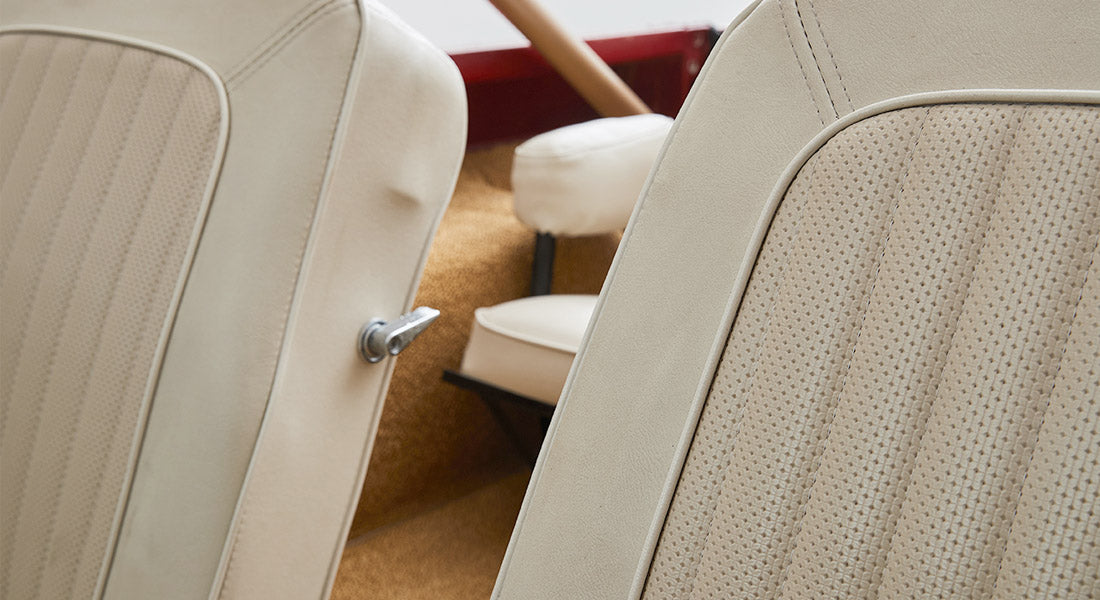 Light beige front seats with textured fabric pattern inside Classic Ford Bronco