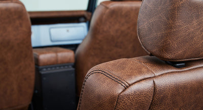 Brown leather seats with visible stitching inside Classic Ford Bronco