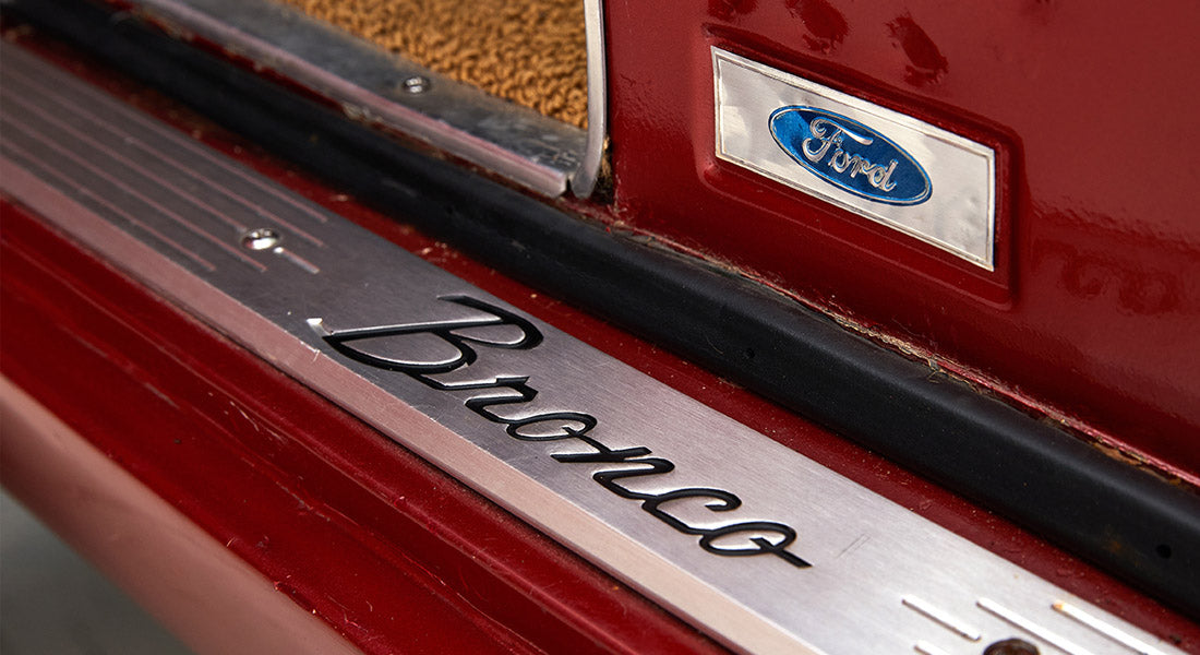 Classic Ford Bronco door sill plate with black Bronco script and blue Ford logo
