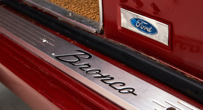 Classic Ford Bronco door sill plate with black Bronco script and blue Ford logo