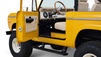 Ford Bronco 1975 in Chrome Yellow with custom Basket Weave Interior and Wimbledon White Wheels