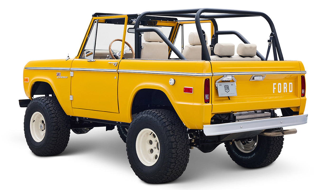 Ford Bronco 1975 in Chrome Yellow with custom Basket Weave Interior and Wimbledon White Wheels