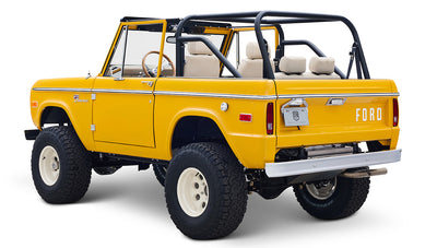 Ford Bronco 1975 in Chrome Yellow with custom Basket Weave Interior and Wimbledon White Wheels