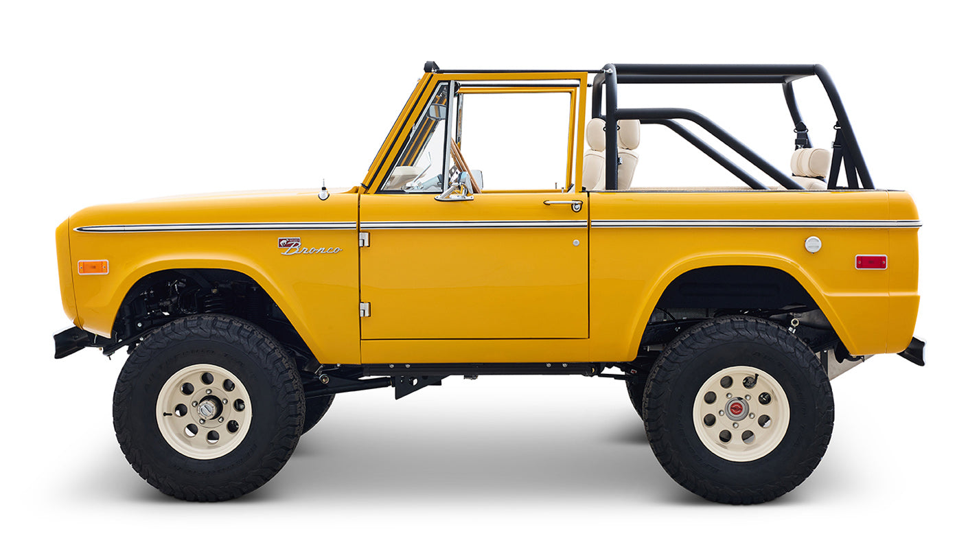 Ford Bronco 1975 in Chrome Yellow with custom Basket Weave Interior and Wimbledon White Wheels