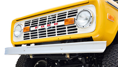 Ford Bronco 1975 in Chrome Yellow with custom Basket Weave Interior and Wimbledon White Wheels