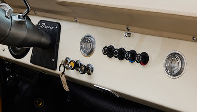 Ford Bronco 1975 in Chrome Yellow with custom Basket Weave Interior and Wimbledon White Wheels