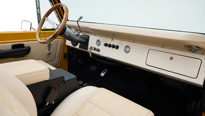 Ford Bronco 1975 in Chrome Yellow with custom Basket Weave Interior and Wimbledon White Wheels