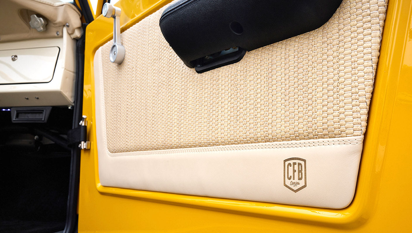 Ford Bronco 1975 in Chrome Yellow with custom Basket Weave Interior and Wimbledon White Wheels