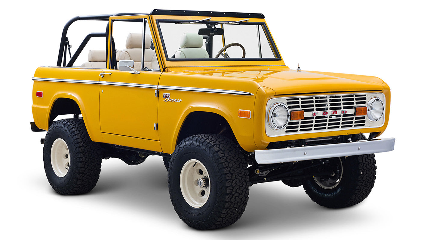 Ford Bronco 1975 in Chrome Yellow with custom Basket Weave Interior and Wimbledon White Wheels