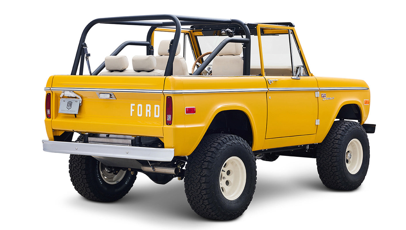 Ford Bronco 1975 in Chrome Yellow with custom Basket Weave Interior and Wimbledon White Wheels