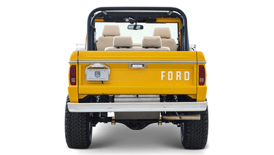 Ford Bronco 1975 in Chrome Yellow with custom Basket Weave Interior and Wimbledon White Wheels