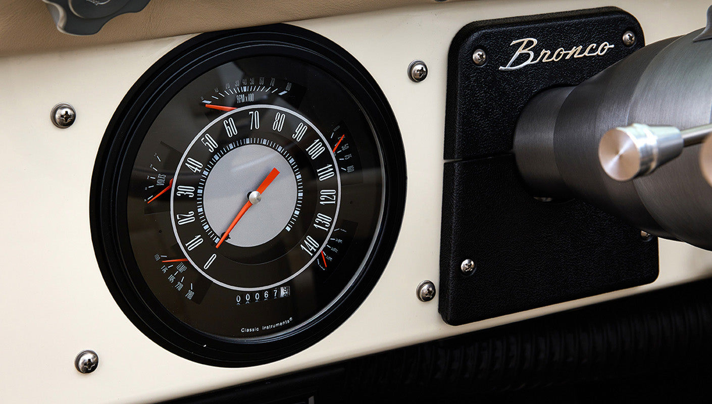 Ford Bronco 1975 in Chrome Yellow with custom Basket Weave Interior and Wimbledon White Wheels