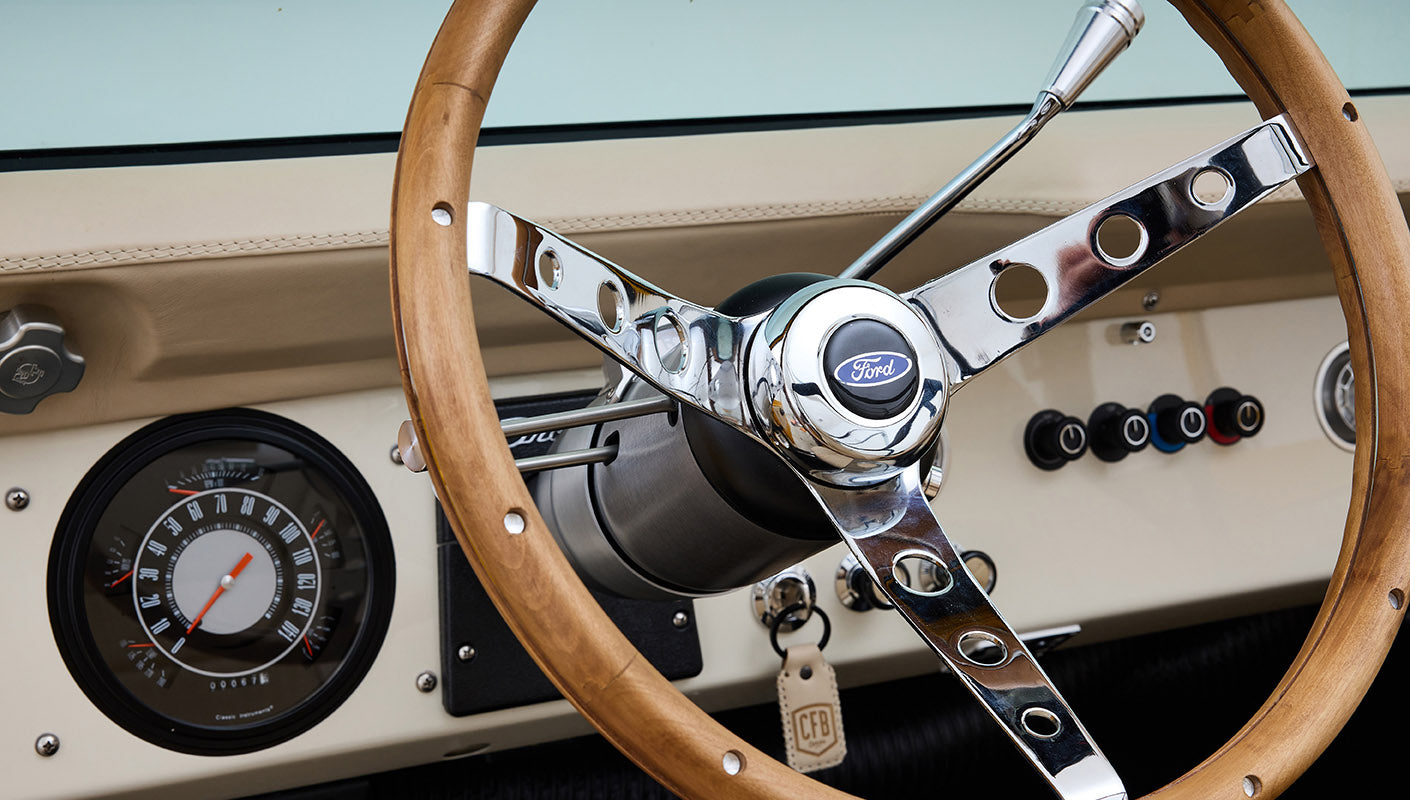 Ford Bronco 1975 in Chrome Yellow with custom Basket Weave Interior and Wimbledon White Wheels