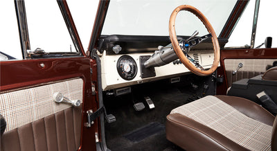 Black sidestep mounted to Classic Ford Bronco door frame with brown paint visible