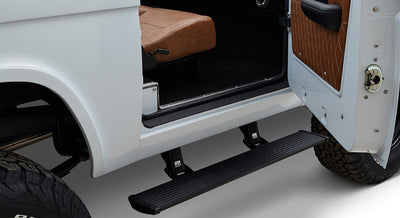 Powerstep running board extended from the side of a Classic Ford Bronco with open door