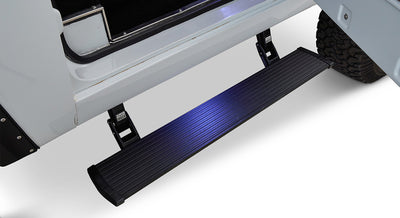 Black retractable powerstep installed below the door of a Classic Ford Bronco