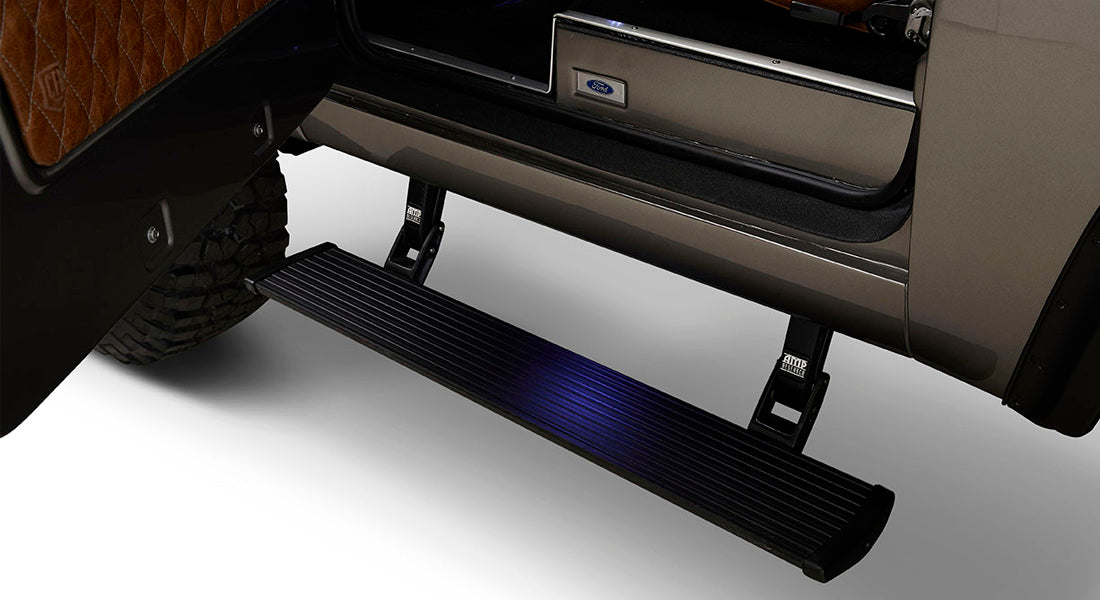 Classic Ford Bronco powerstep running board and tire portion under vehicle door