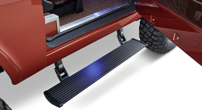 Extended black automatic powerstep running board attached under Classic Ford Bronco door