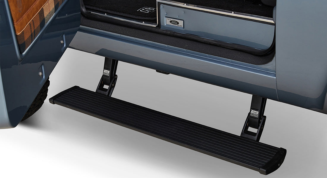 Black side step attached below the door of a Classic Ford Bronco