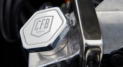 Metal radiator cap with CFB Series logo and welded radiator area