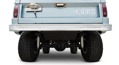 Rear undercarriage of a Classic Ford Bronco with visible axle, tires, and tailgate