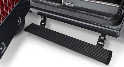 Black running board attached below the open door of a Classic Ford Bronco.