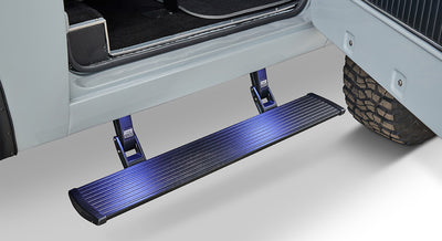 Black running board step extending from the side of a Classic Ford Bronco beneath the open door