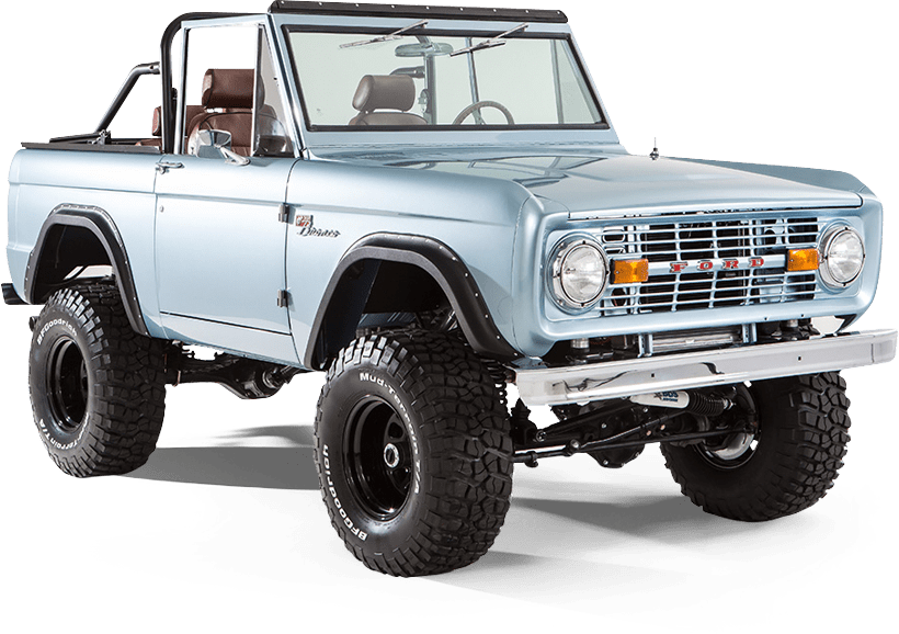 Side view of light blue Classic Ford Bronco with black wheels and lifted suspension