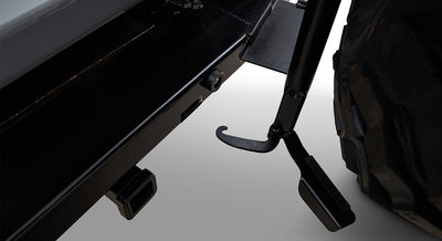 Metal frame and tire carrier hook under the rear of a Classic Ford Bronco near the bumper