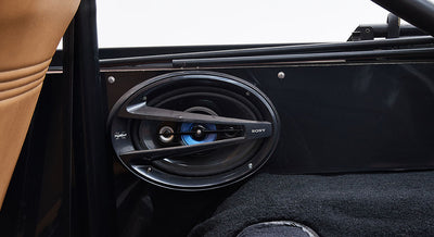 Sony speaker installed inside the door panel of a Classic Ford Bronco