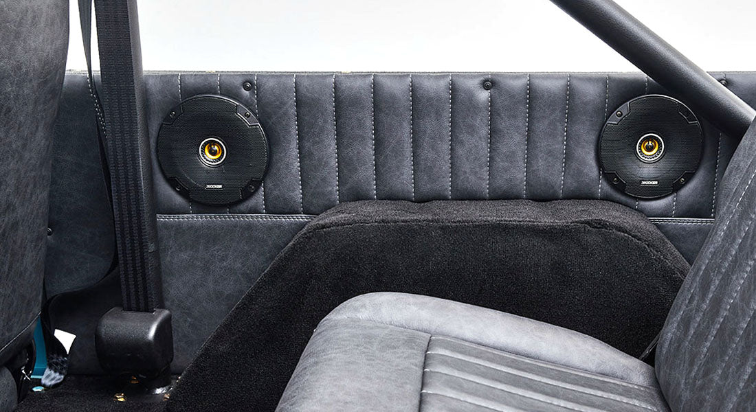Rear interior panel with two mounted speakers inside a Classic Ford Bronco