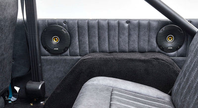 Rear interior panel with two mounted speakers inside a Classic Ford Bronco