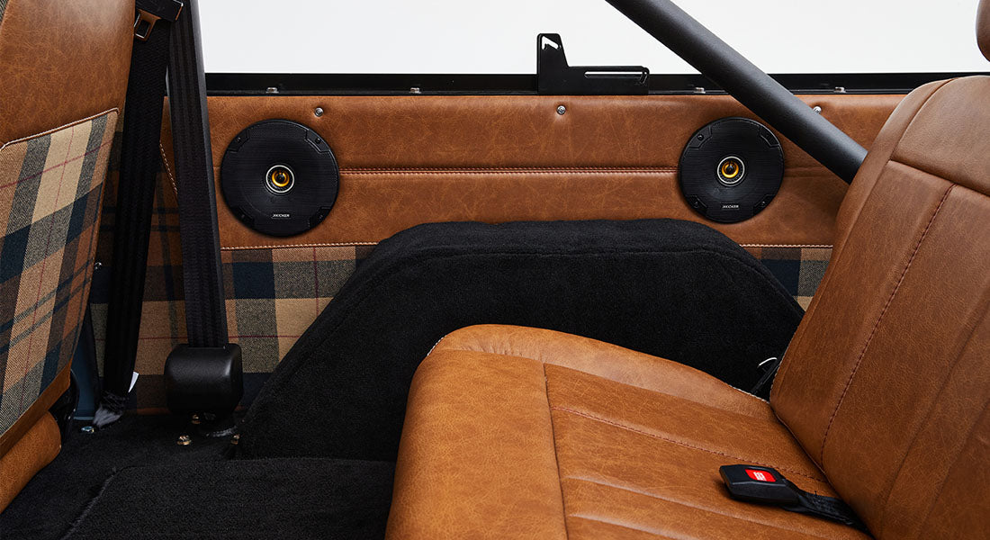 Rear speakers and brown leather seating inside Classic Ford Bronco