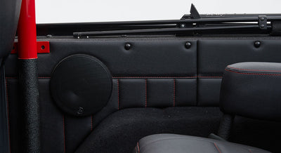 Black JL Audio speaker mounted inside a Classic Ford Bronco door panel