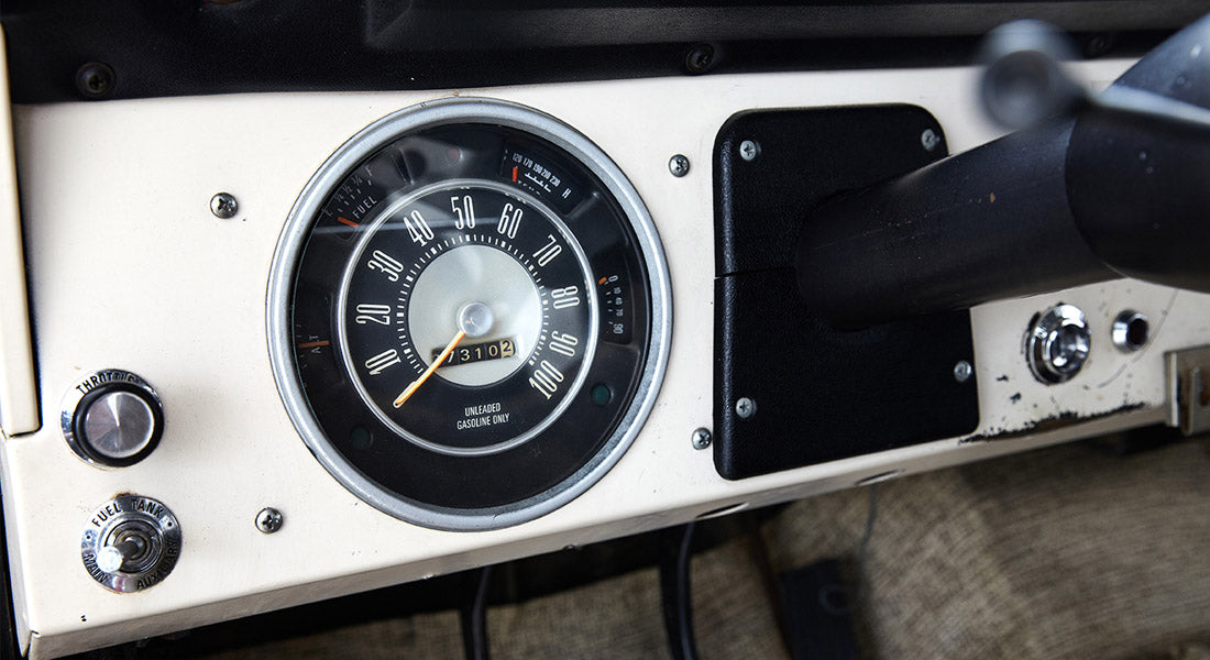 Speedometer and dashboard controls of a Classic Ford Bronco with fuel and temperature gauges