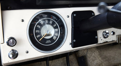 Speedometer and dashboard controls of a Classic Ford Bronco with fuel and temperature gauges
