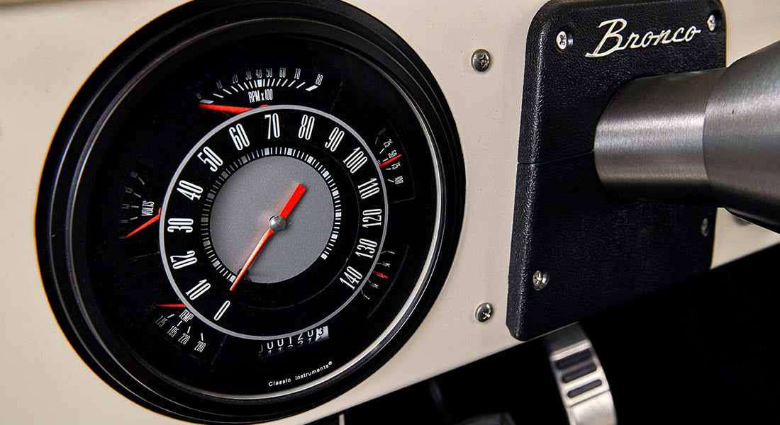 Classic Ford Bronco speedometer with black dial and red needle