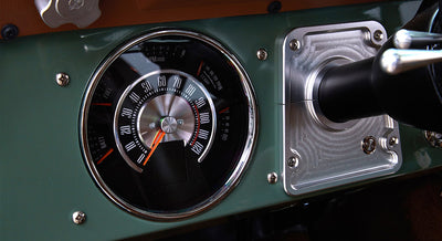 Speedometer and tachometer gauge in green Classic Ford Bronco dashboard