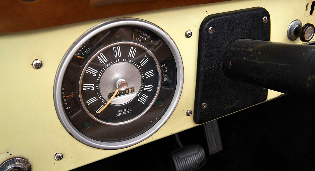 Classic Ford Bronco dashboard speedometer showing speed up to 100 with odometer reading 17797