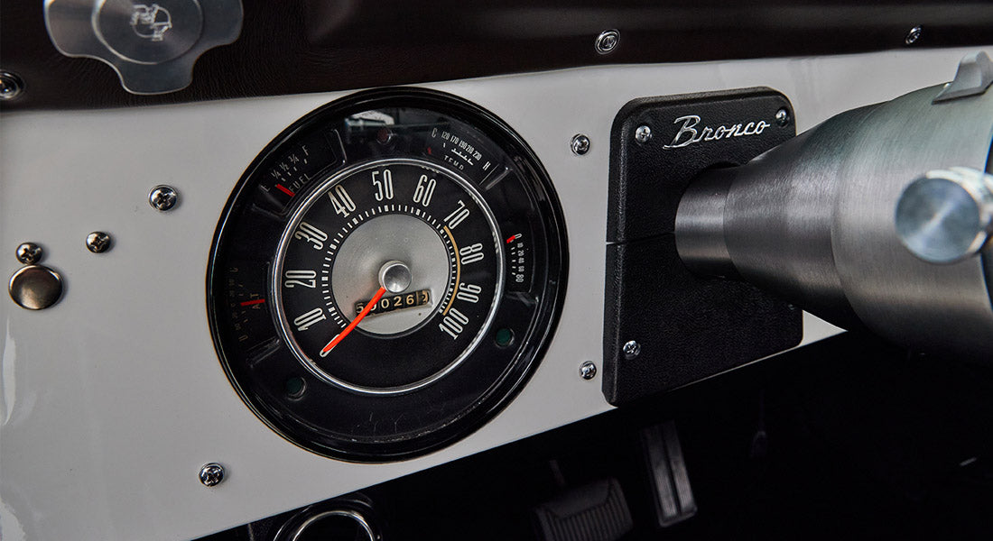 Dashboard speedometer and Bronco emblem on steering column housing of Classic Ford Bronco